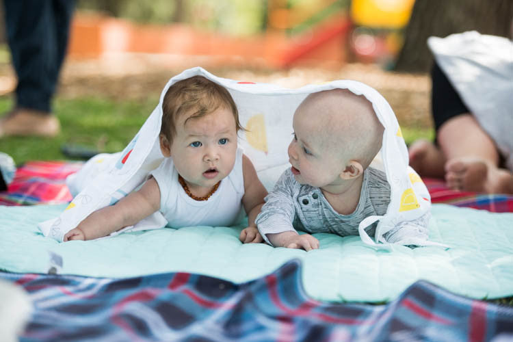 Two babies under musluv baby sun shade cover