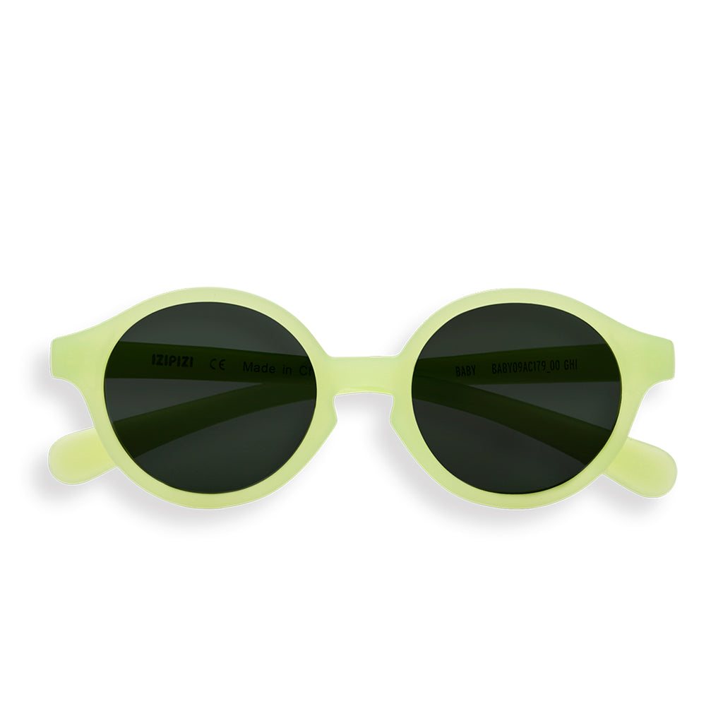 Front view of baby green sunglasses on white background 